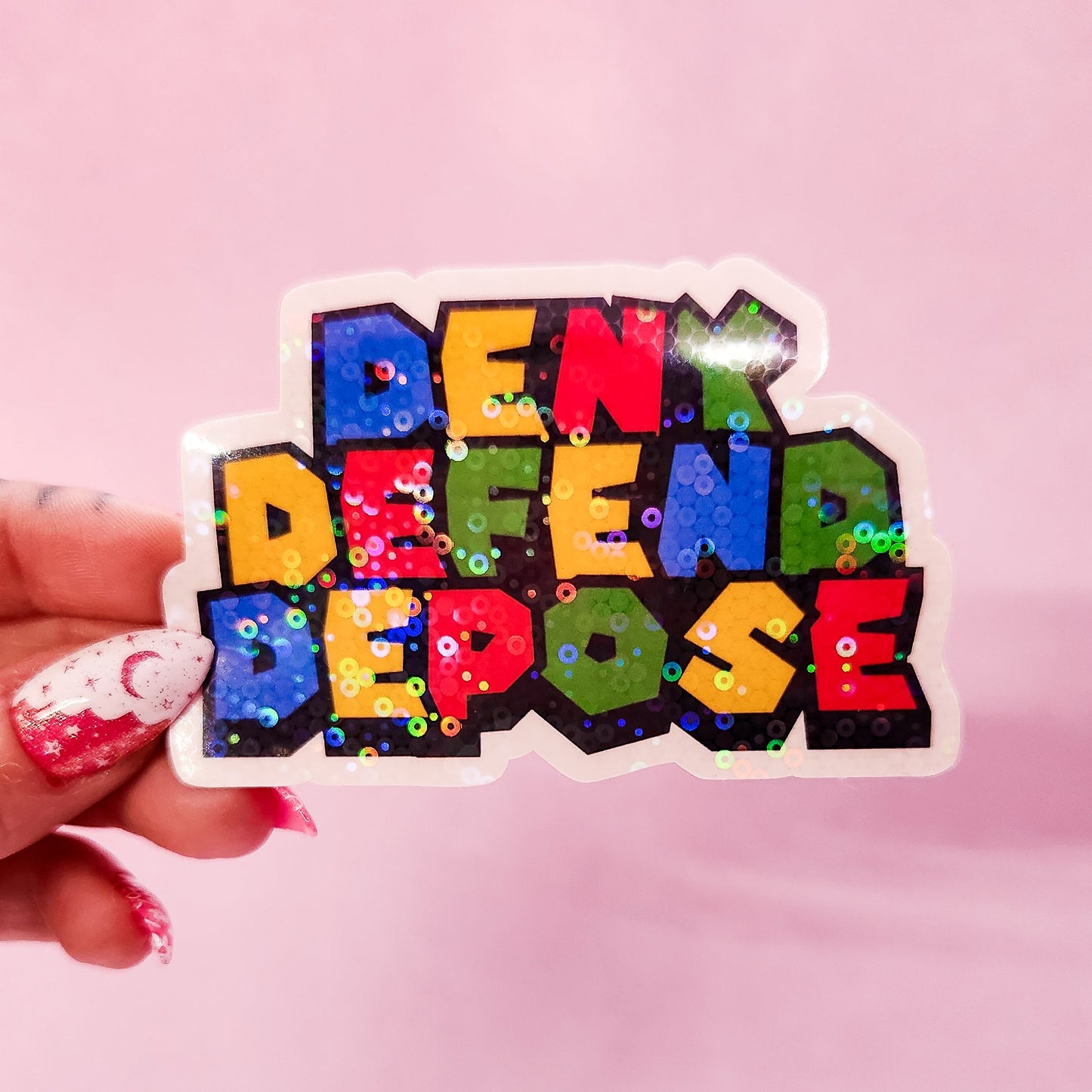 Deny Defend Depose Holographic Sticker, 3.3 x 2.2 in.