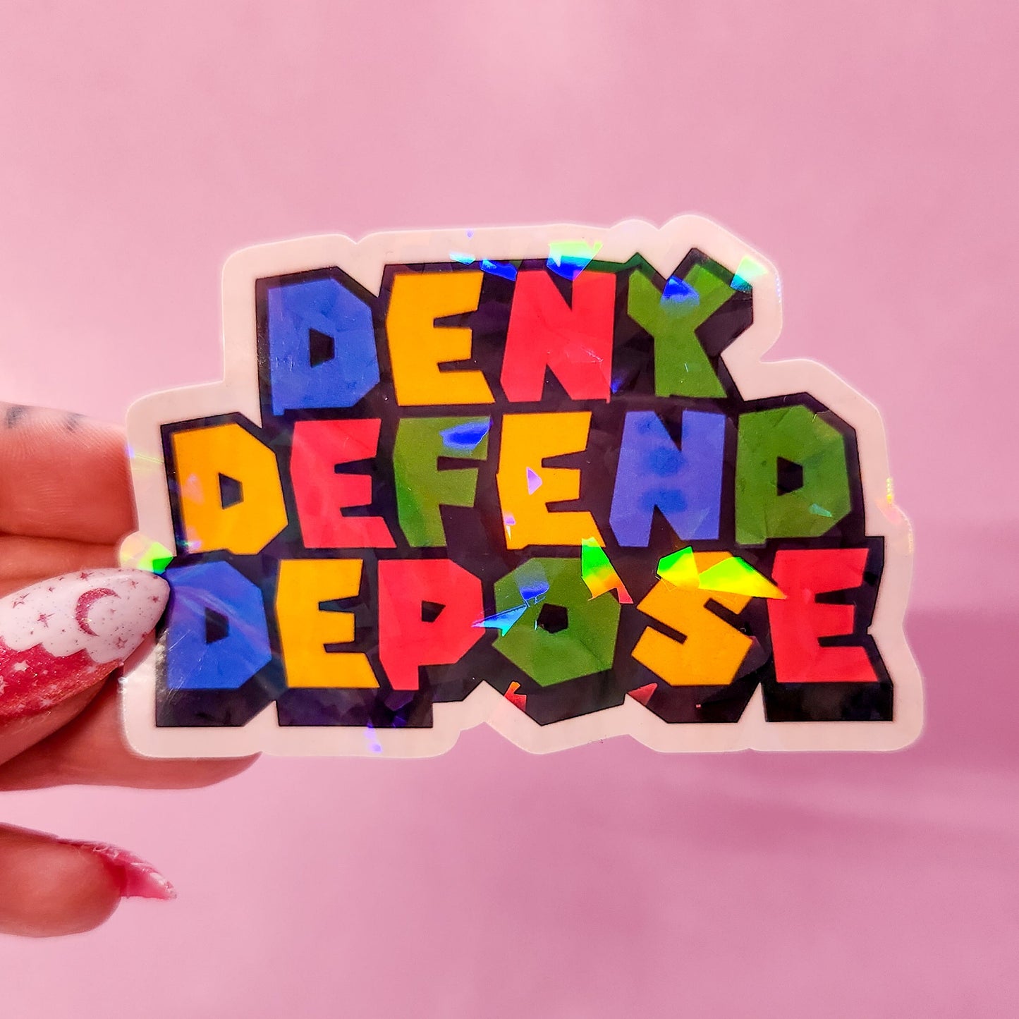 Deny Defend Depose Holographic Sticker, 3.3 x 2.2 in.