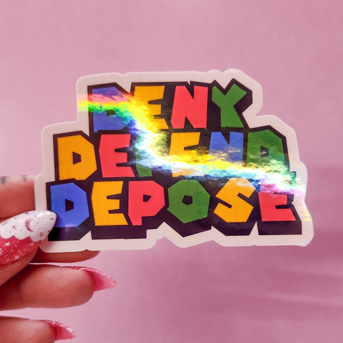 Deny Defend Depose Holographic Sticker, 3.3 x 2.2 in.