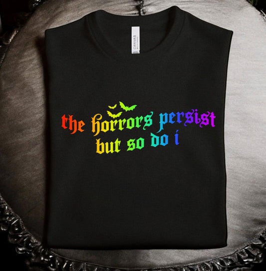Rainbow the horrors persist but so do i T-shirt